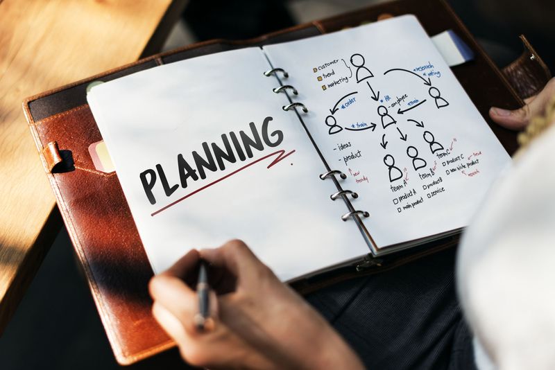 Woman writing and planning business strategy